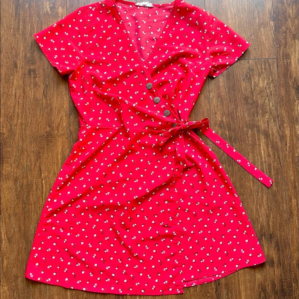 Red dress with waist tie and flower detail